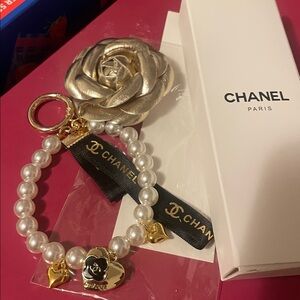 CHANEL Gold Rose Keychain with Pearls